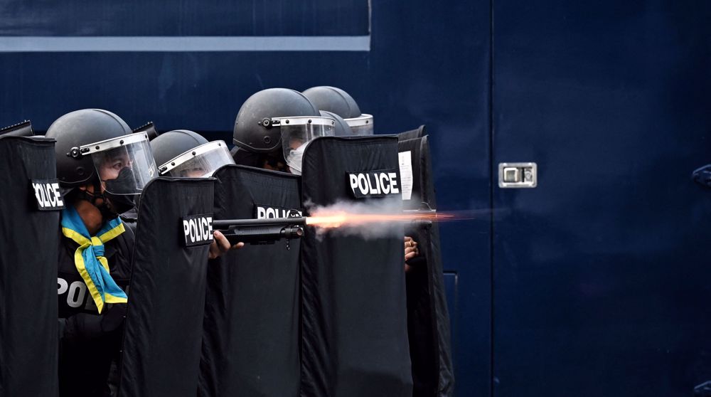 Thai police use water cannon, tear gas at protest