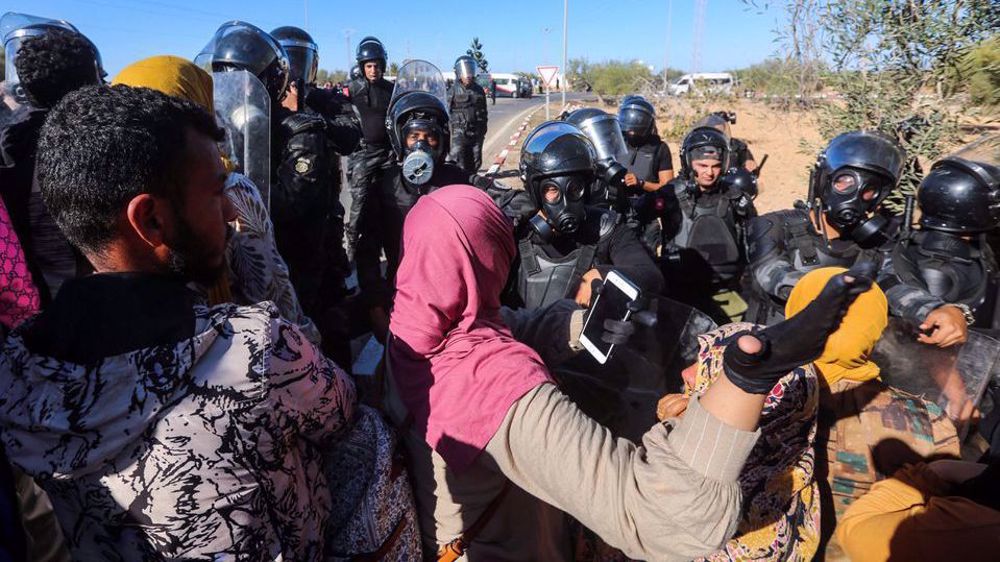 Tunisian forces fire teargas to disperse protesters near Francophonie summit venue