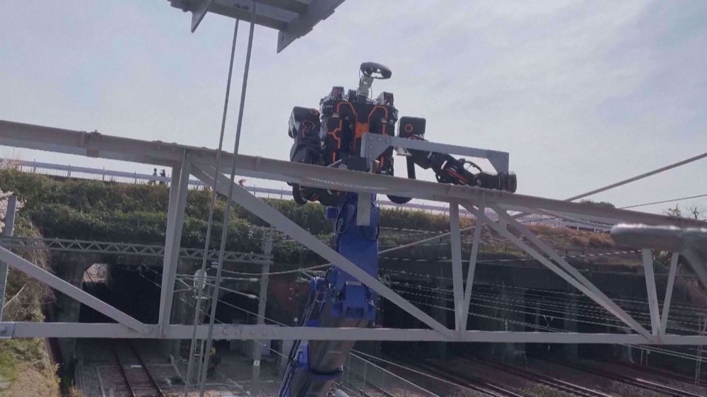 Japan's giant humanoid robot helps fix hard-to-reach railway cables
