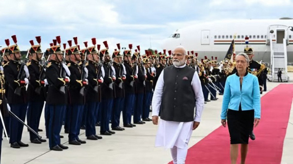 India buys French fighter jets, submarines as Modi visits Paris