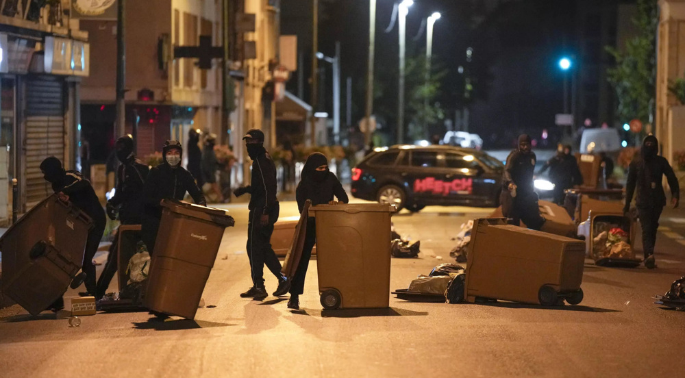 Macron warns of 'deep division' in France after police killing of teen