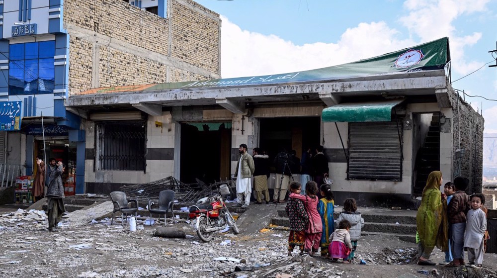 Pakistan deploys helicopters, drones to retake town from insurgents