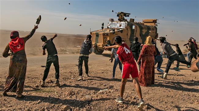 Turkish forces fire shots at protesters near Syria’s Kobani