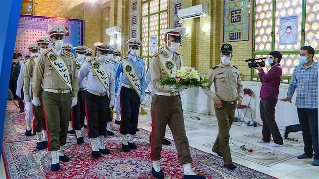 Iranians sprinkle rose petals on tombs of 1981 terror victims