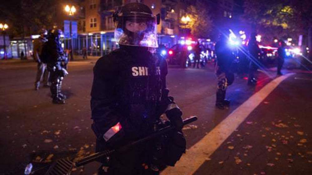 Protesters burn US flags after police shooting of black man