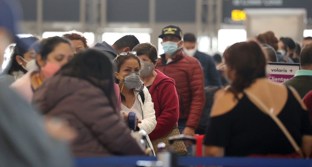 Americans defy pandemic as US COVID deaths top 2,000 a day