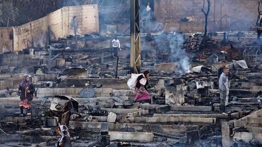 Lebanon arrests eight after refugee camp set ablaze