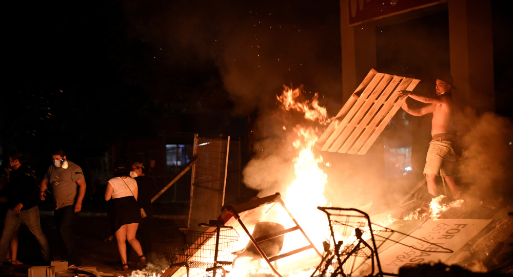 Protests, looting erupt in Minneapolis over racially charged killing by police