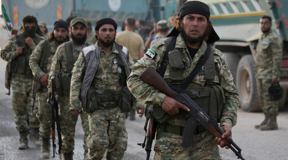 Turkish-backed militants set fire to grain farms in NE Syria