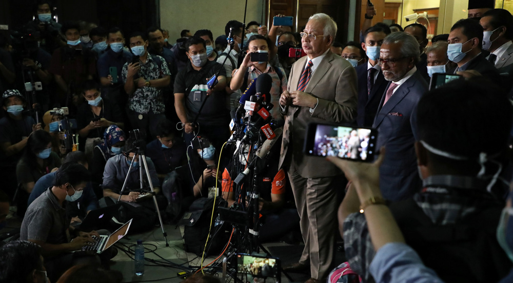 Malaysia’s ex-PM Najib handed 12 years in 1st corruption case