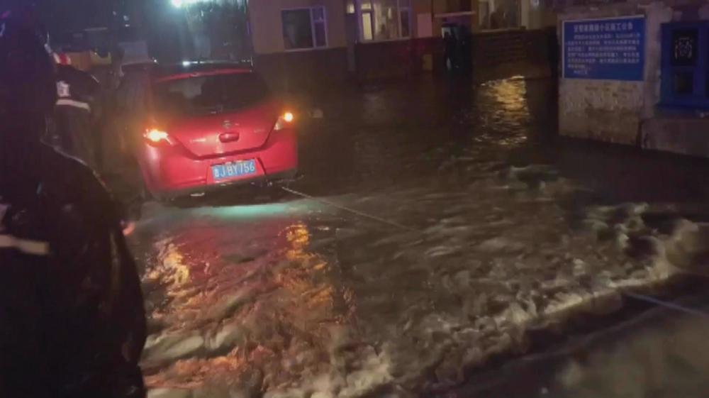 Torrential rain in China triggers flood, evacuations 