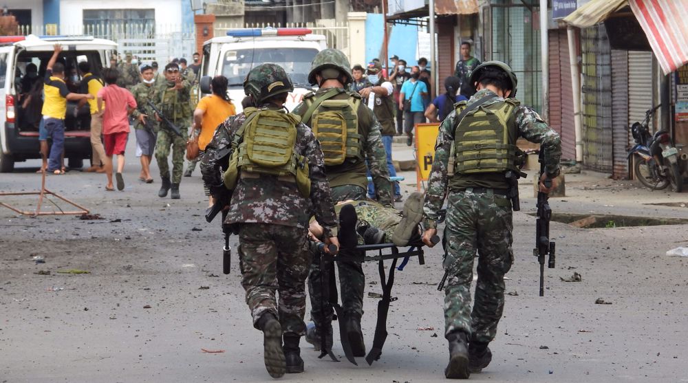 Twin blasts kill at least 10, wounds dozens in southern Philippines