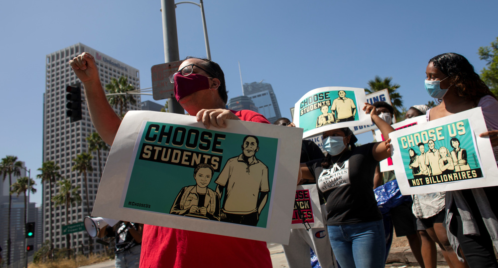 US teachers protest school reopenings as virus deaths pass 155,000 