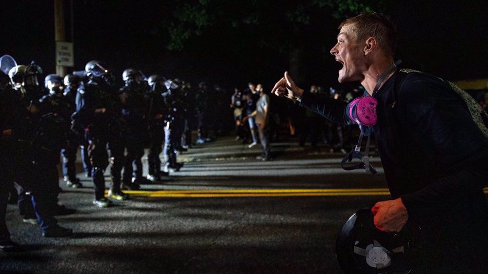 Clashes in Portland erupt again, US police make 11 arrests