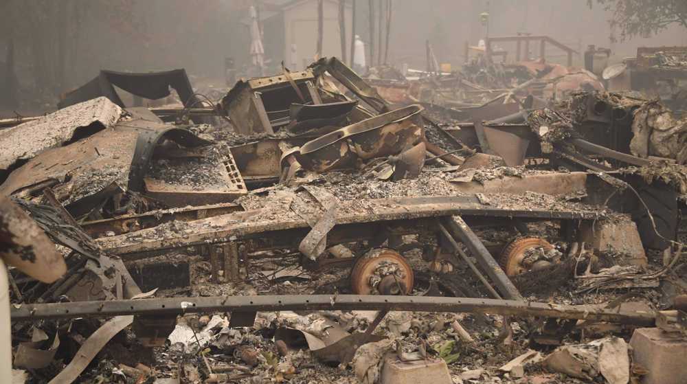 Search for dead resumes as wildfires torch US West