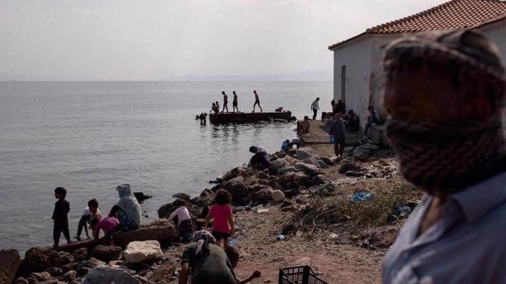 Greek police arrest 5 refugees over fire at camp