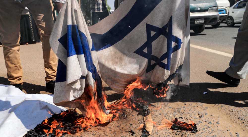 Sudan protesters burn Israeli flag, slam normalization deal