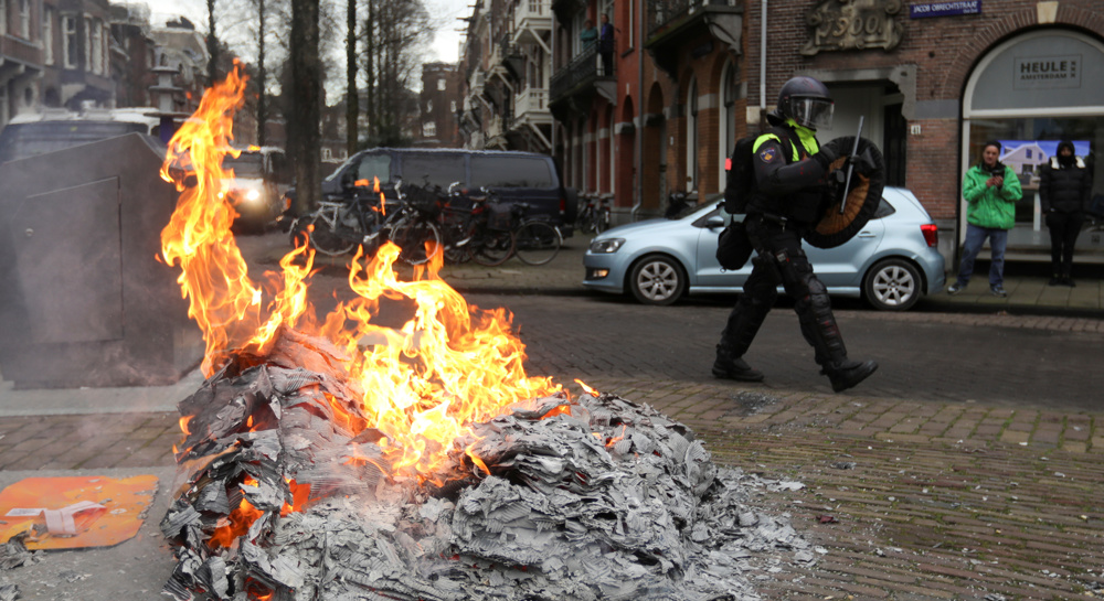 Dutch police use water cannon at protest against COVID measures