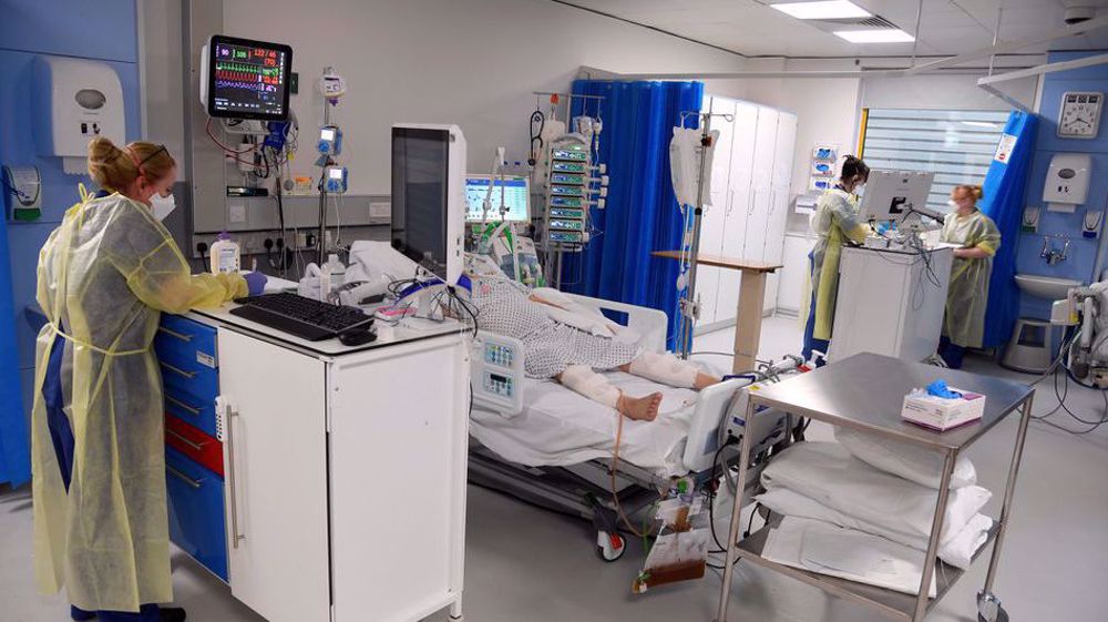 UK COVID-19 cases hit record high, health staff absence double before Christmas