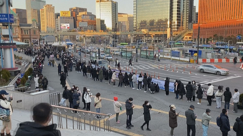 Hundreds queue for virus tests in South Korea as cases reach record levels
