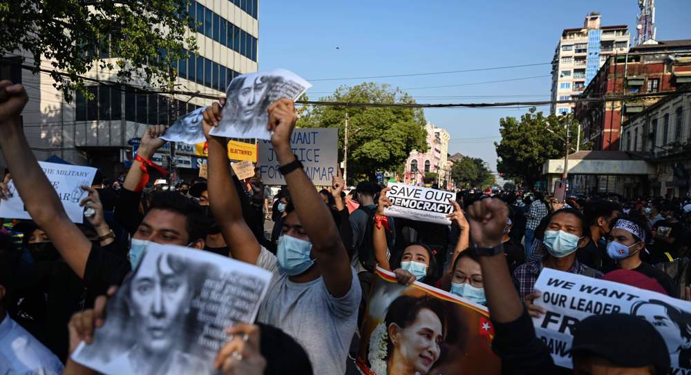 Myanmar military pledges new election as thousands join anti-coup protests
