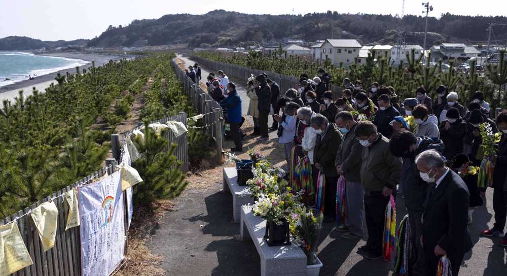 Japan falls silent to mark decade since tsunami disaster