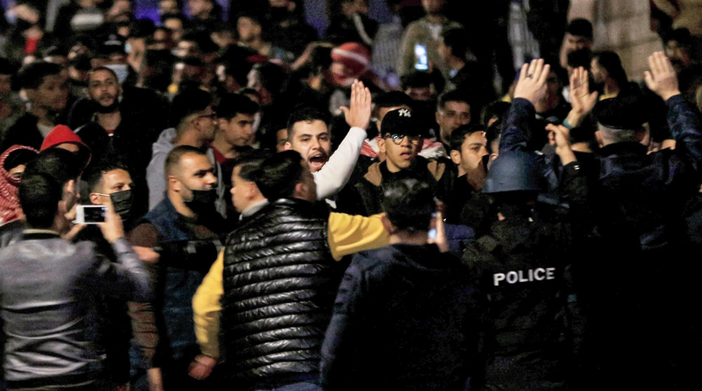 Police clash with anti-lockdown protesters in Jordan