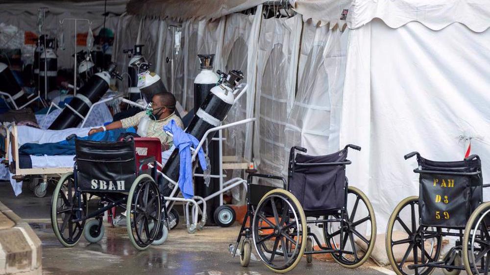 India runs out of COVID-19 vaccines, Brazil tops grim 400,000 mark