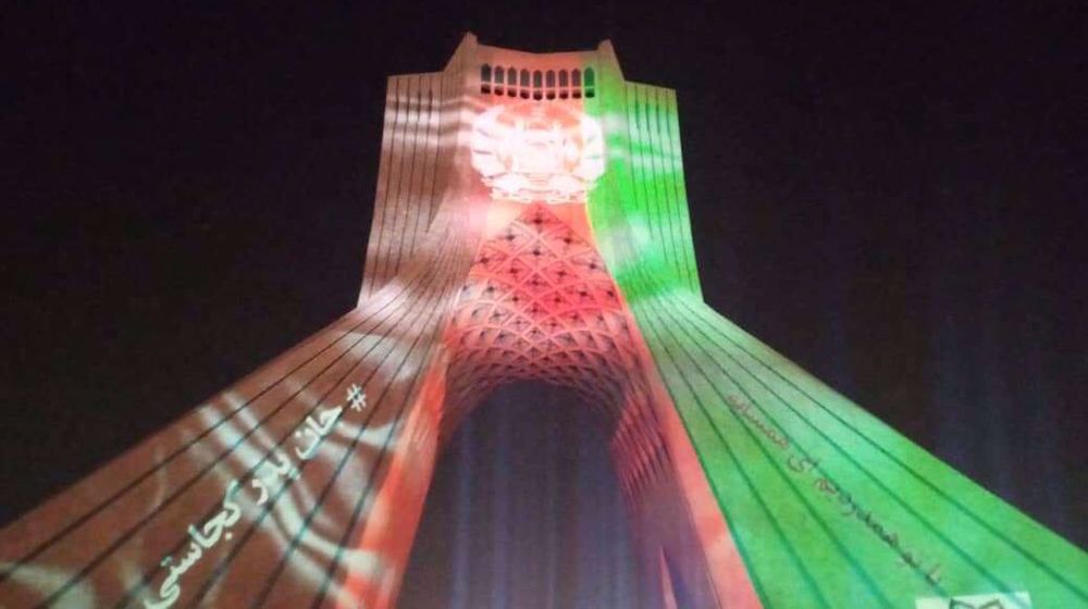 Tehran Azadi Tower lit up with colors of Afghan flag in honor of Kabul school victims