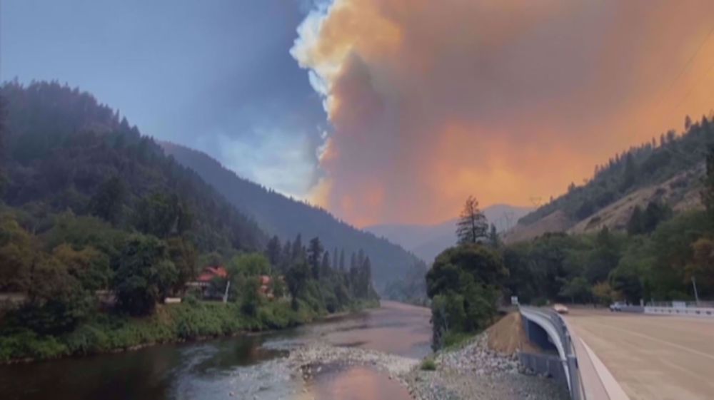 Wildfire burns near site of deadliest US blaze