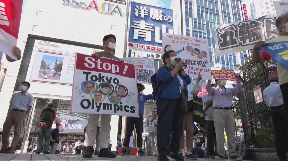 Protesters march down streets in Tokyo to call for Olympics cancellation