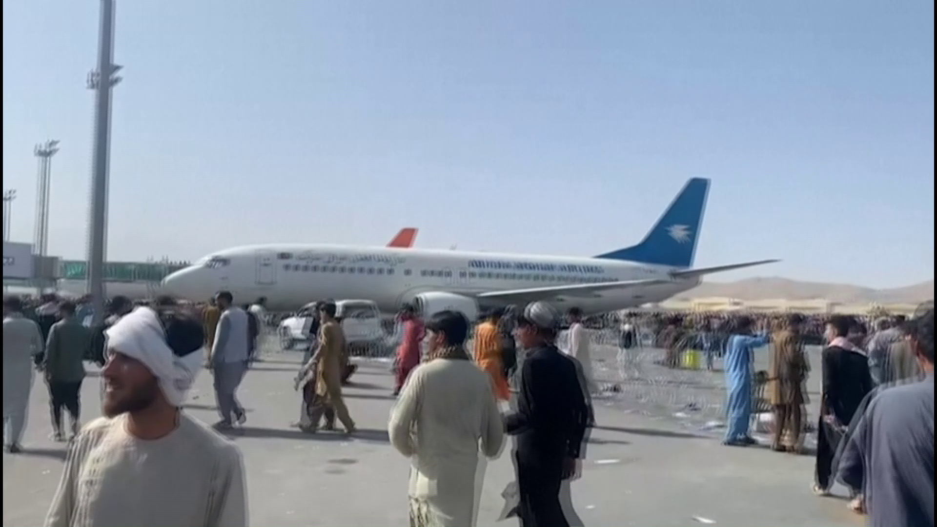 Desperate Afghans crowd Kabul airport apron to flee Taliban
