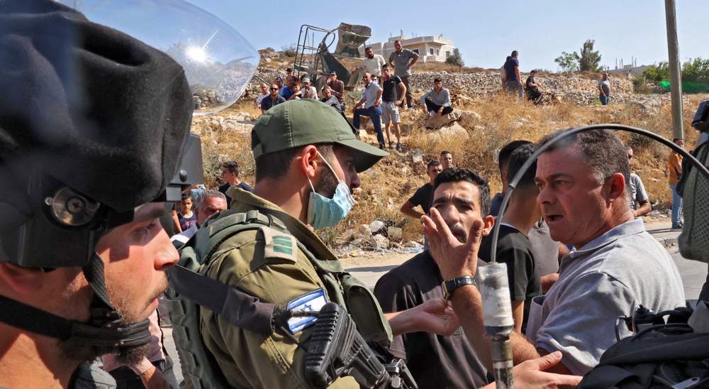 Israeli troops force another Palestinian to demolish own home