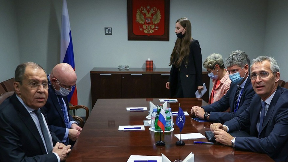 Russia says will not join NATO as two sides hold rival drills