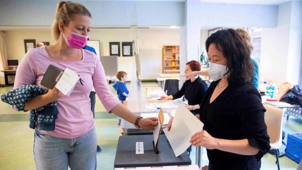 Germans vote in close election to decide Merkel successor