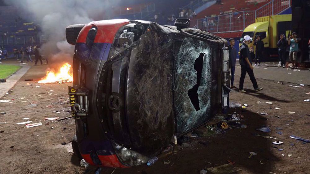 Indonesia pres. orders probe after over 170 killed in stadium stampede 
