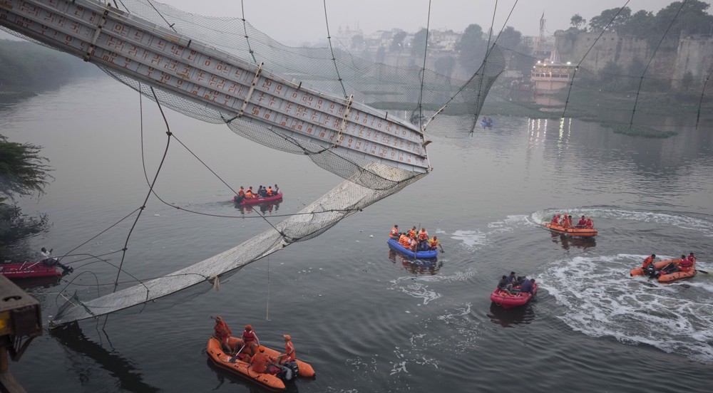 Nine arrested after India bridge collapse kills more than 130