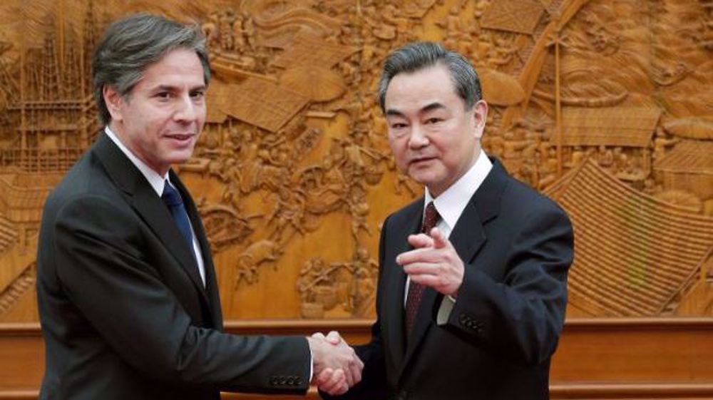 China urges US to stop trying to suppress Beijing 