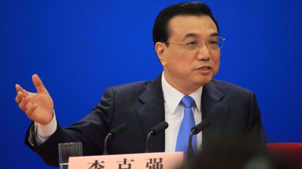 China vows peaceful Taiwan ties, 'reunification', slams foreign meddling