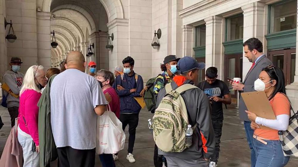 Migrants bused to DC as part of Texas governor's protest against Biden