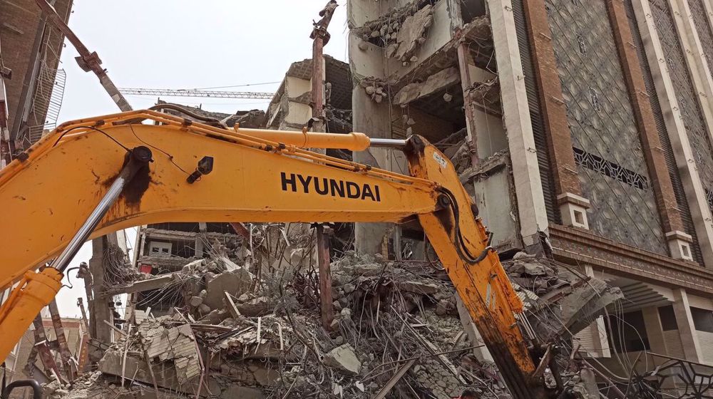 Several people dead, scores trapped under rubble as building collapses in SW Iran