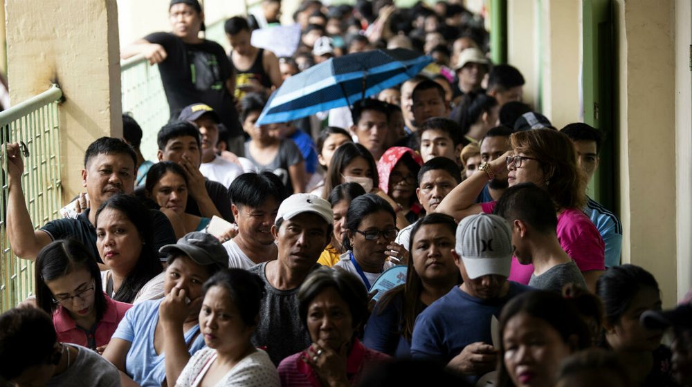 Philippines votes in presidential election as Marcos family eyes return to power