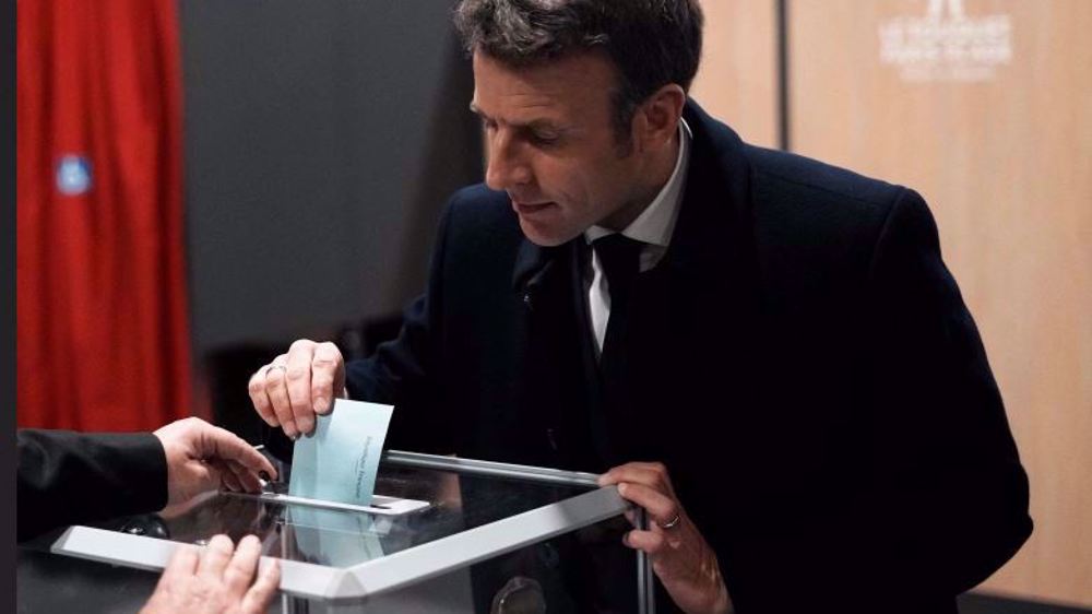 Macron likely to keep parliamentary grip thanks to record abstention