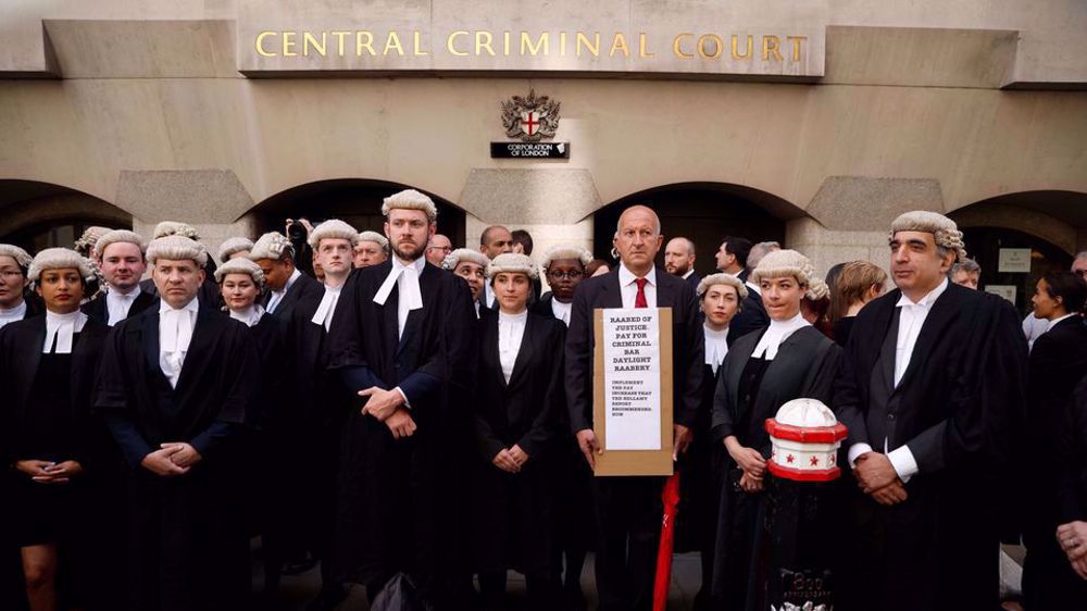 Britain's criminal lawyers stage walkout in dispute over govt. funding, wages