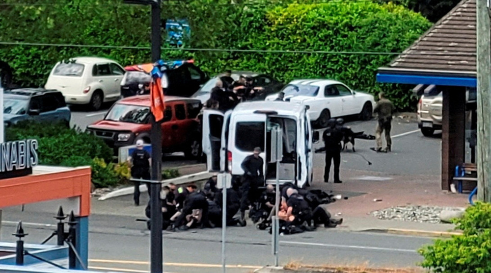 Two gunmen killed, six officers wounded in shootout at Canadian bank