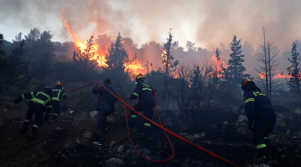 Residents evacuated as wildfire rages out of control near Athens
