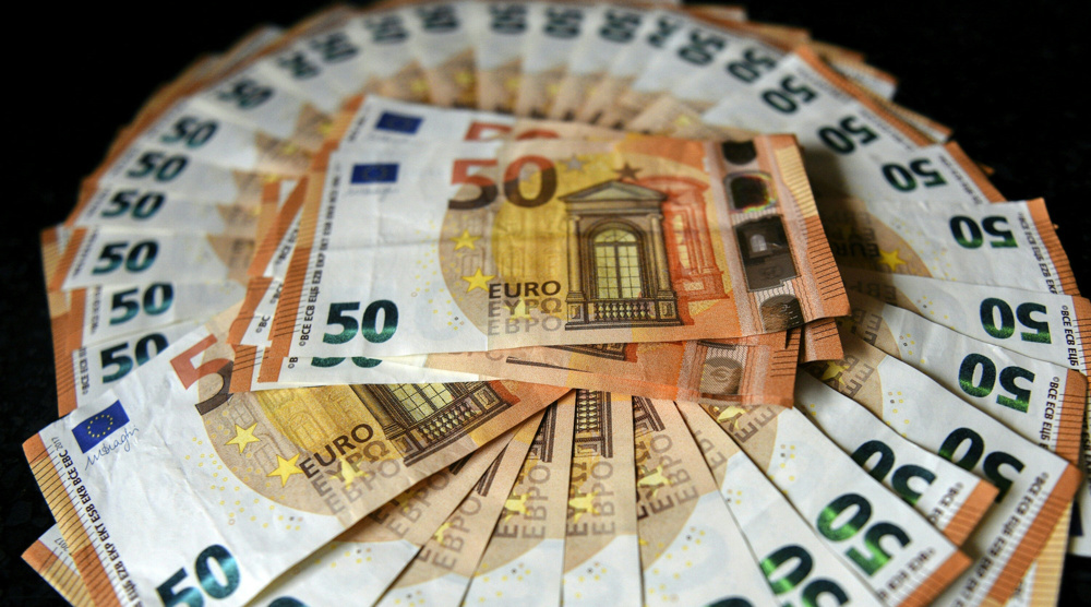 Euro, dollar at parity for first time in two decades