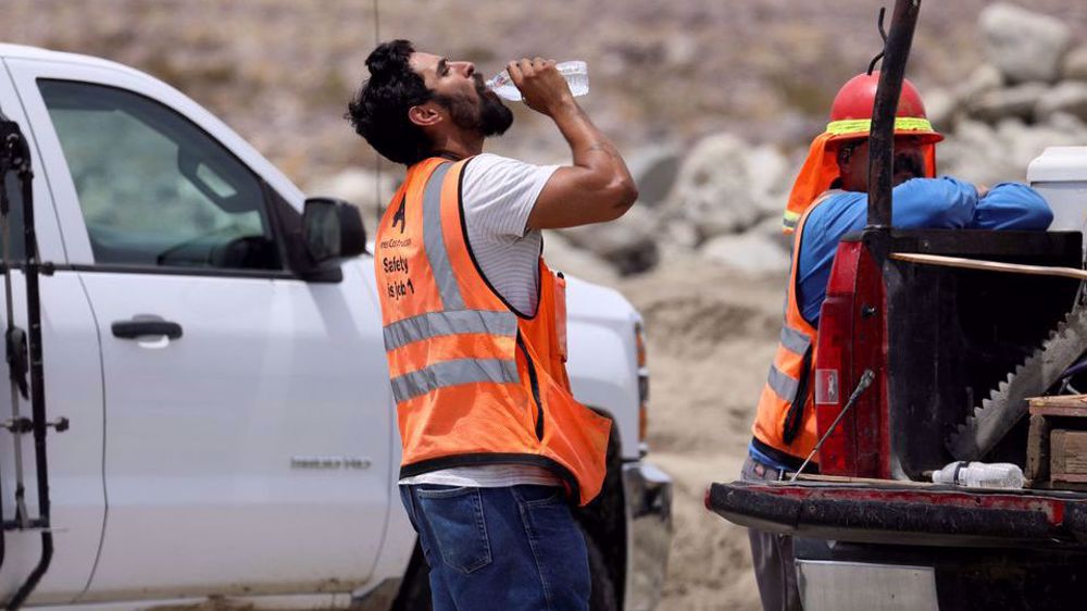 US heat wave bakes Americans as California wildfire rages 