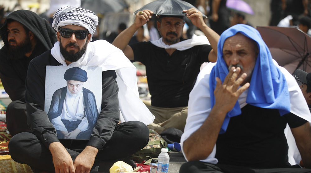 Iraq’s Sadr supporters perform Friday prayers outside Parliament