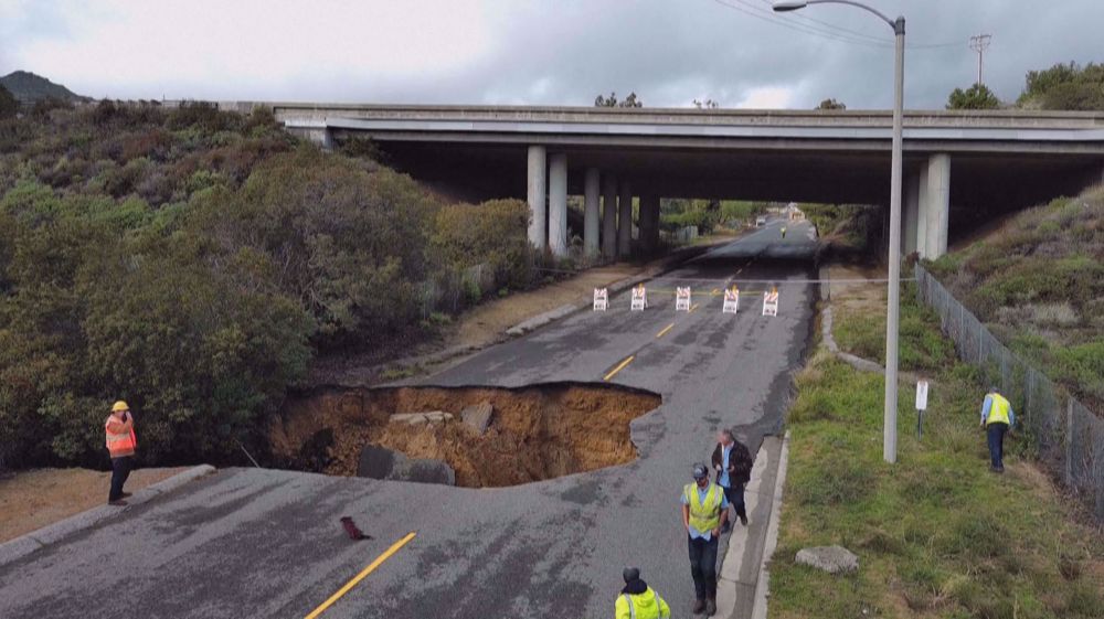 Massive sinkhole swallows two vehicles in Los Angeles